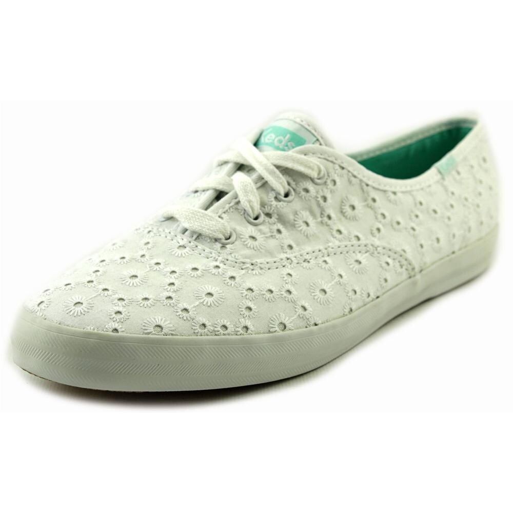 white eyelet tennis shoes
