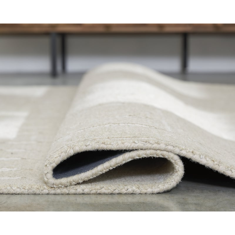 Signature Design by Ashley Wolbert Tan/Ivory 7'8" x 10' Area Rug - 92" W x 120" D x 0.31" H