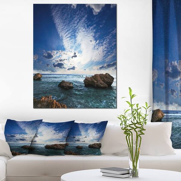 Designart "Rocky Beach with White Clouds" Modern Beach Canvas Art Print ...