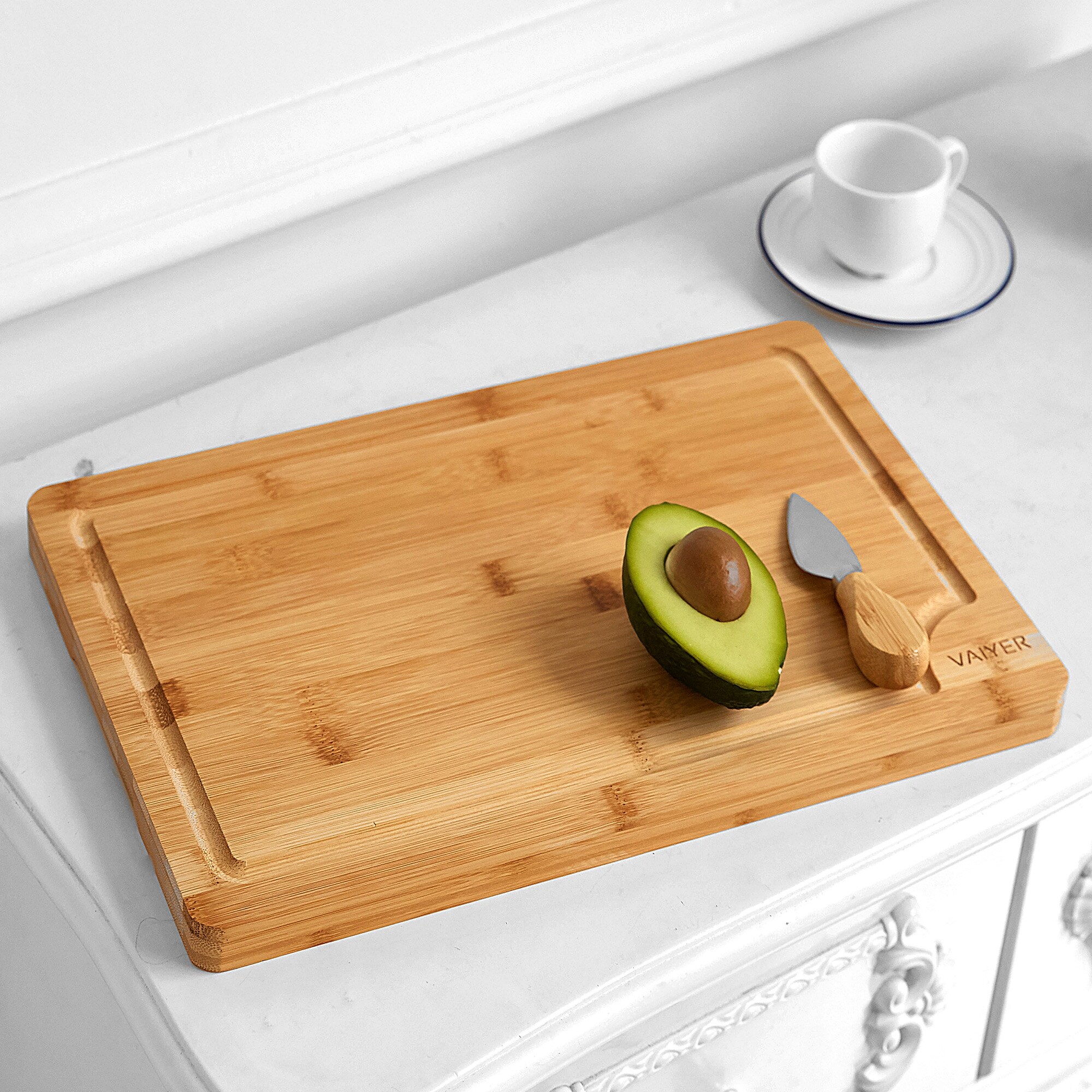 https://ak1.ostkcdn.com/images/products/is/images/direct/871205a1ede0a9b512bed61354cac59bd02c9312/Vaiyer-Organic-Bamboo-Cutting-Board-w--Juice-Groove%2C-Heavy-Duty-Kitchen-Chopping-Board-for-Meat%2C-Chicken%2C-Cheese-and-Vegetables.jpg