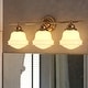 preview thumbnail 1 of 11, Huntley Natural Brass Gold Bathroom Vanity Lighting Fixture, White Schoolhouse Milk Glass Globe Shade, Dimmable, LED Compatible 24-in W x 10-in H x 7-in D - Natural Brass