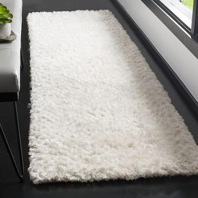 SAFAVIEH Handmade Saint Tropez Shag Yuiko Solid Polyester Rug