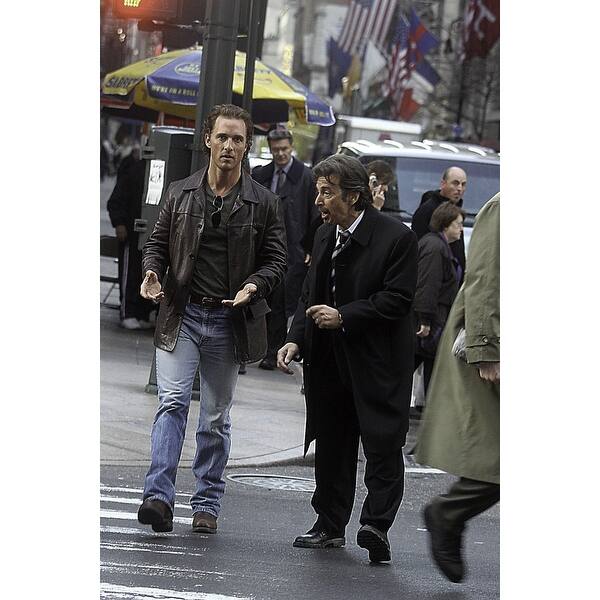 A film still of Al Pacino and Matthew McConaughey walking across a