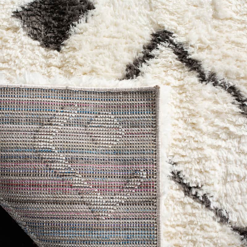 SAFAVIEH Handmade Flokati Sylvette Shag Solid Polyester Rug