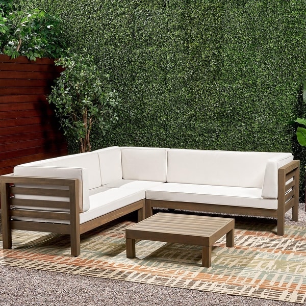 Oana Outdoor 5 Seater V Shaped Mid Century Modern Acacia Wood Sectional Sofa Set with Coffee Table by Christopher Knight Home