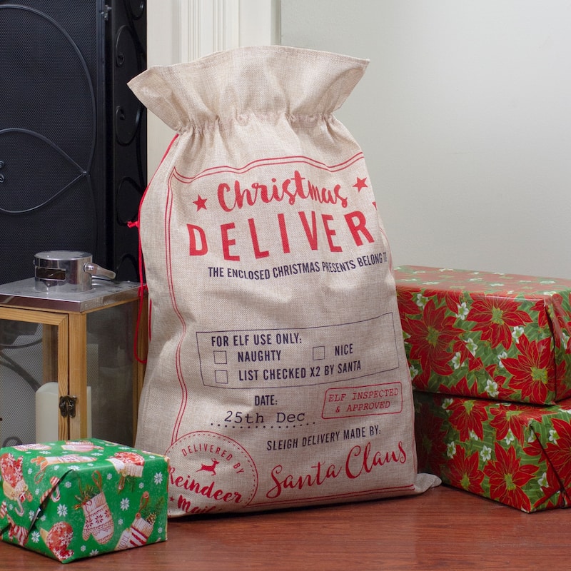27" Beige and Red "Christmas Delivery" Tie Gift Bag