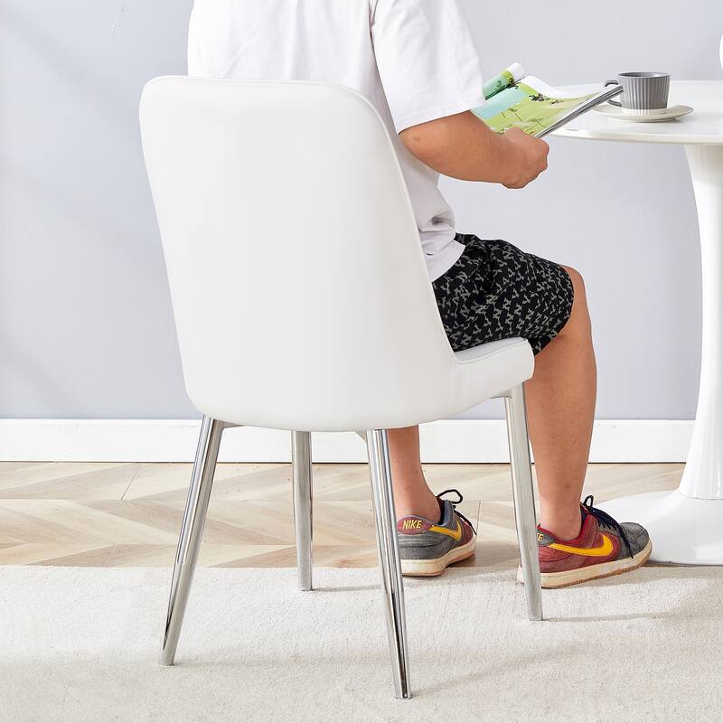 2 modern dining chairs, smooth PU leather backrest and silver-toned metal legs for a comfortable home experience