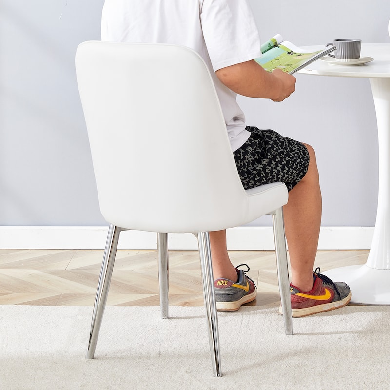 4 modern dining chairs, sleek PU leather backrest, and silver metal legs bring a comfortable home experience