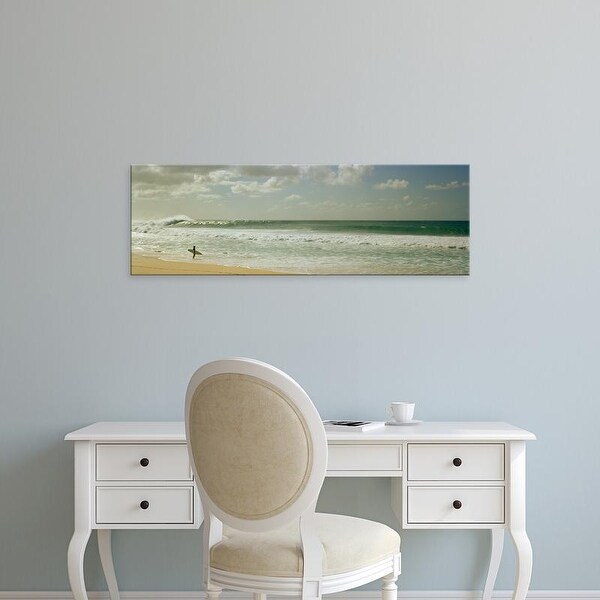 Easy Art Prints Panoramic Images's 'Surfer standing on the beach, North Shore, Oahu, Hawaii, USA' Premium Canvas Art