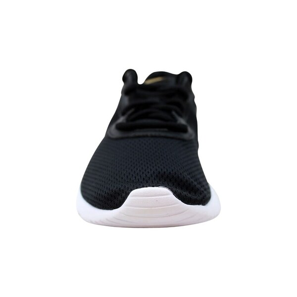 nike tanjun black metallic gold