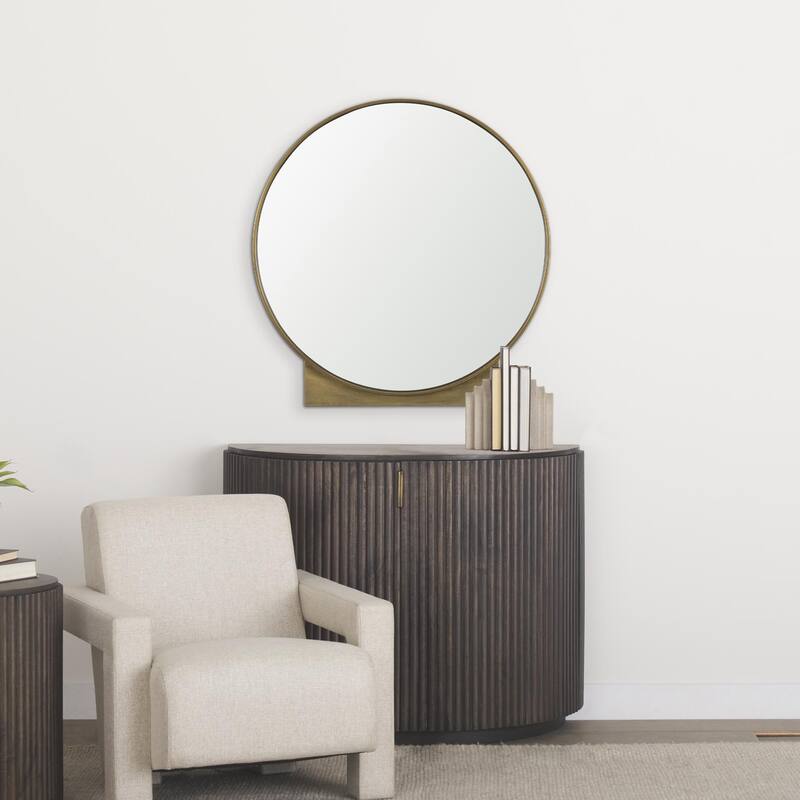 Tillie is a round mirror with a brushed gold metal frame. - 36.0L x 1.8W x 37.5H