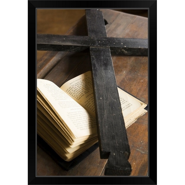 "black wooden cross on top of an opened bible" Black Framed Print