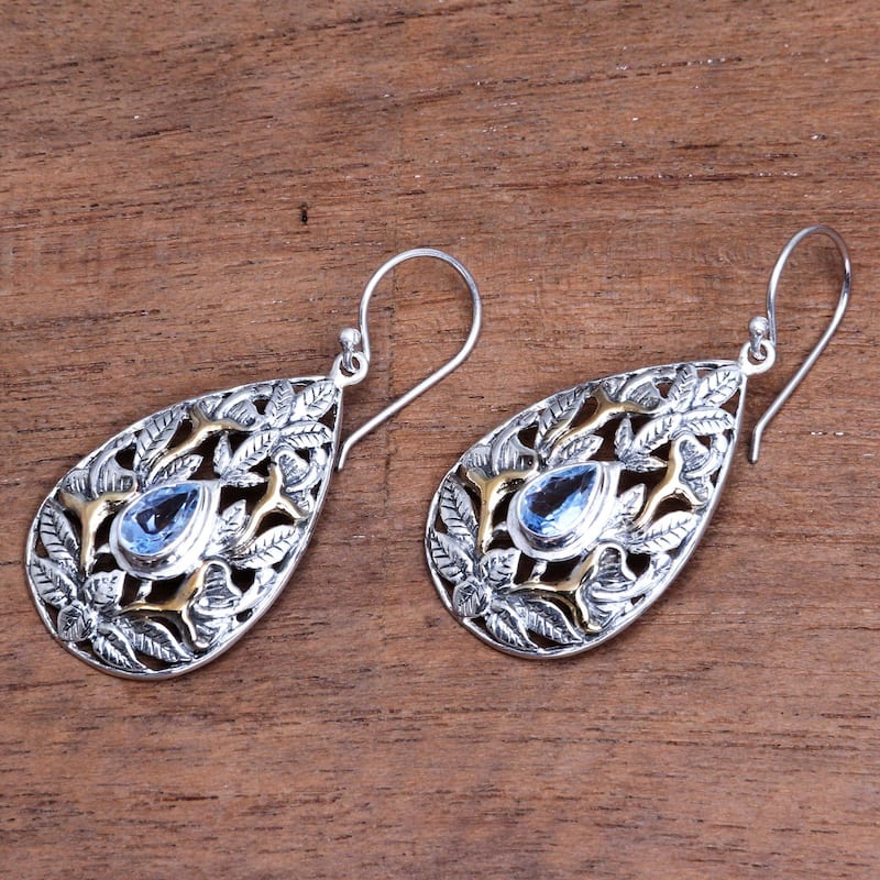 NOVICA Hidden Jungle, Gold accented blue topaz dangle earrings - 1.8*0.8