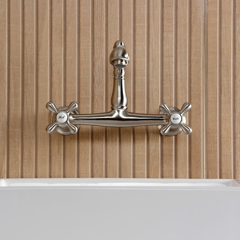 Kingston Brass English Country Two-Handle 2-Hole Wall Mount Bathroom Faucet