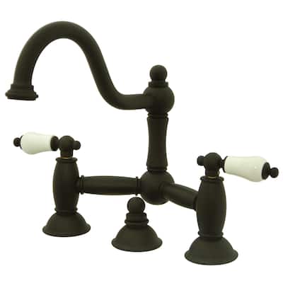 Kingston Brass Restoration Bridge Bathroom Faucet with Pop-Up Drain