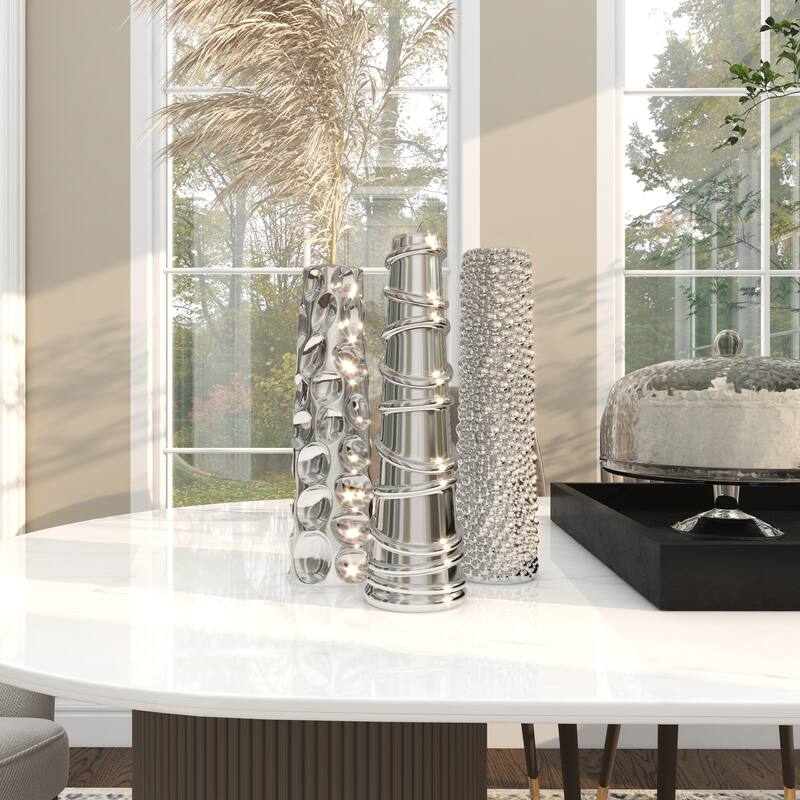 CosmoLiving by Cosmopolitan Sleek Ceramic Glam Vase with Varying Patterns (Set of 3) - Silver, Gold, Dark Blue, White