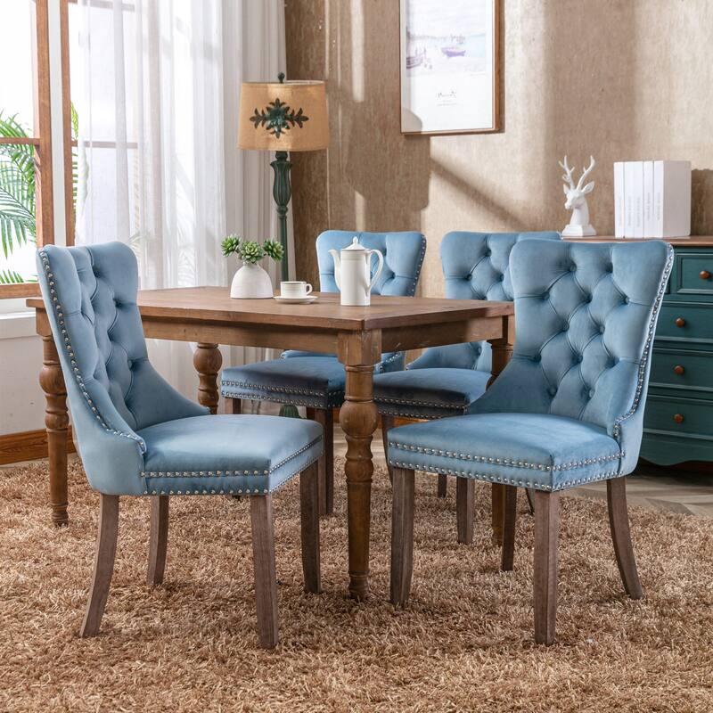 Contemporary Velvet Upholstered Dining Chair with Solid Wood Legs and Nailhead Trim, Offering Luxurious Comfort and Style.