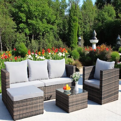 4-Piece Outdoor Patio Furniture Set, PE Rattan Sectional with 3-Seat Sofa, Armchair, Ottoman, and Tempered Glass Coffee Table