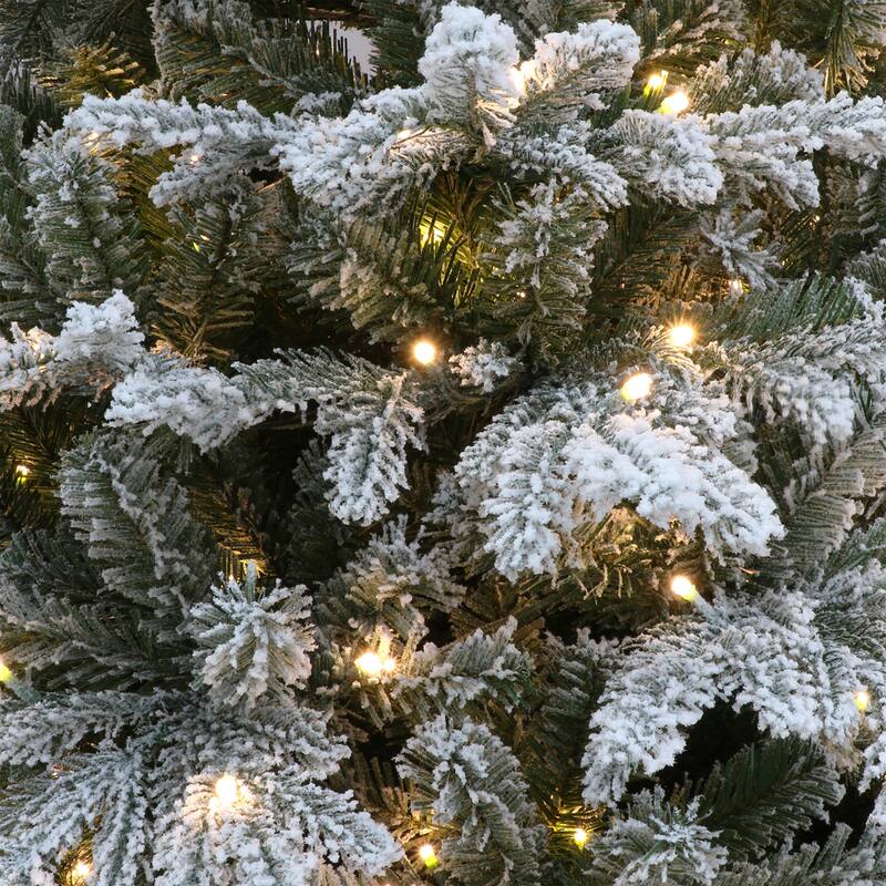 Puleo International 7.5' Pre-Lit Flocked Alaskan Winter Fir Tree with Dual-Color LED Lights