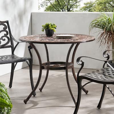 Roomfitters Outdoor Round Cast Aluminum Dining Table in Shiny Copper, Elegant Design with Intricate Patterns