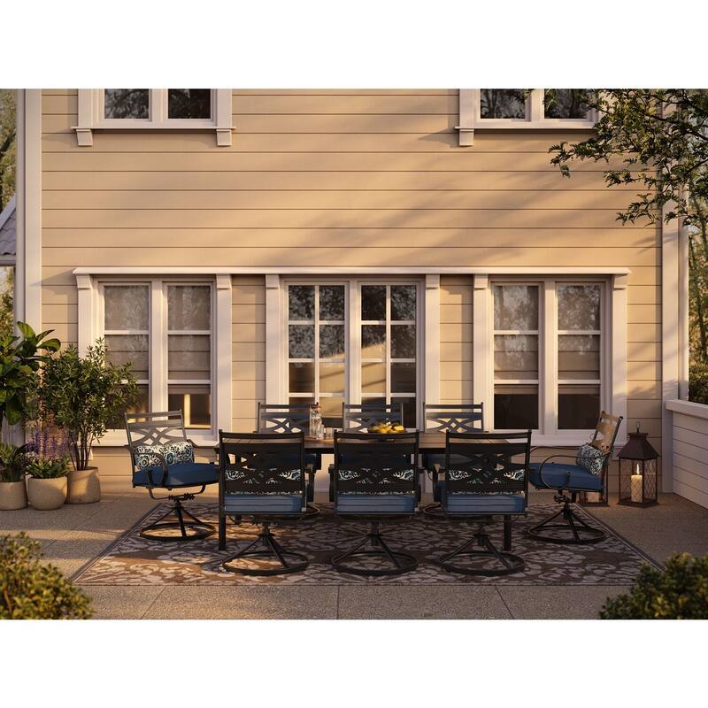Hanover Montclair 9-Piece Dining Set in Navy Blue with 8 Swivel Rockers and a 42-In. x 84-In. Table
