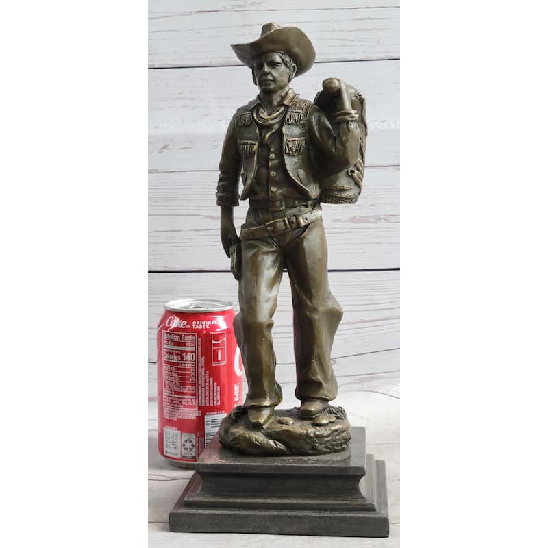 Country Western Cowboy In Chaps Carrying Imitative Horse Saddle Bronze Statue Sculpture Figure 12 Inches X 4 Inches
