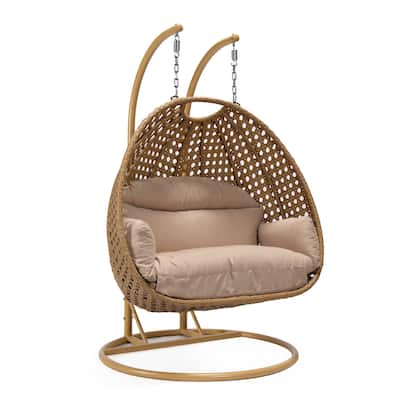 LeisureMod Mendoza 2-Person Hanging Egg Swing Chair - Handcrafted Light Brown Wicker, Patio Hammock Lounger with Cushions - 53"