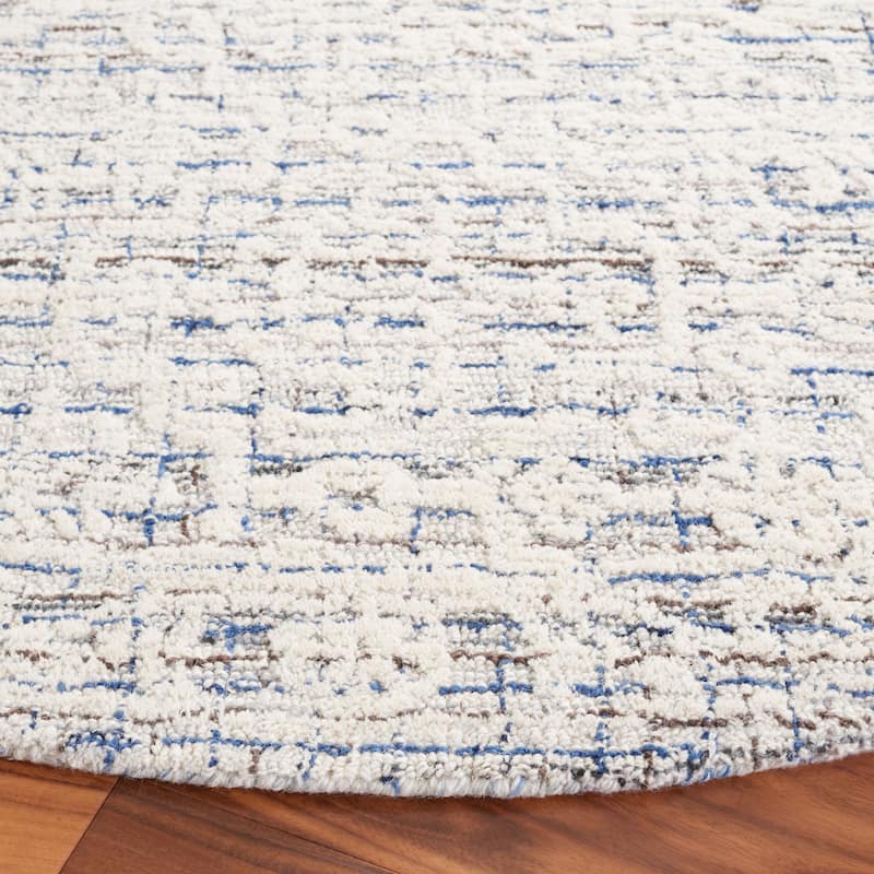 SAFAVIEH Handmade Ebony Pavlinka Modern Wool Rug