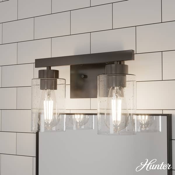 slide 2 of 10, Hunter Hartland Bathroom Vanity Wall Light, Damp Rated - Transitional, Rustic, Contemporary - Clear Seeded Glass 2-Light - Noble Bronze
