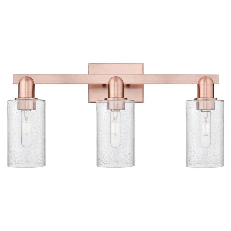 Innovations Lighting Endless Possibilities Arcadia - Clymer - 3 Light 23" Bath Vanity Light - Antique Copper/Seedy