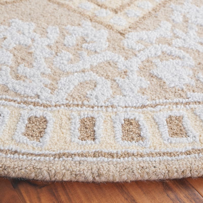 SAFAVIEH Handmade Abstract Kiyomi Medallion Wool Rug