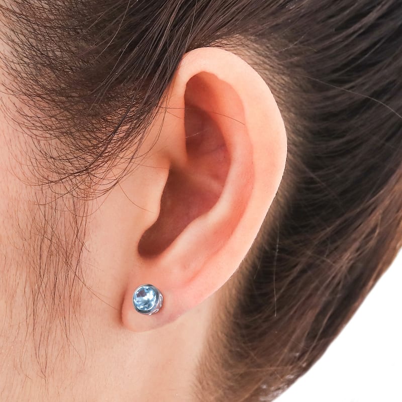 Sterling Silver Spark of Life Blue Topaz Earrings (India)