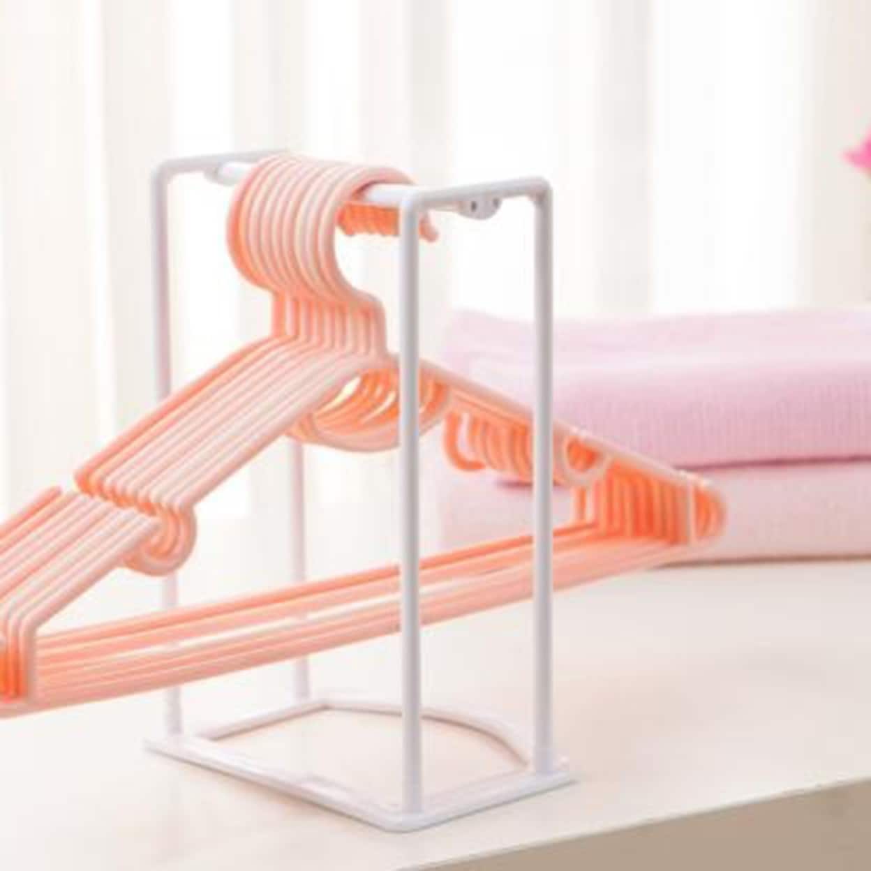 https://ak1.ostkcdn.com/images/products/is/images/direct/8e0e9ec44bdb8bd113bed692c205bdb978d99acf/Clothes-Hanger-Organizer-Convenient-Space-Saving-Pp-Hanger-Stacker-Rack-With-Lifting-Handle-For-Laundry.jpg