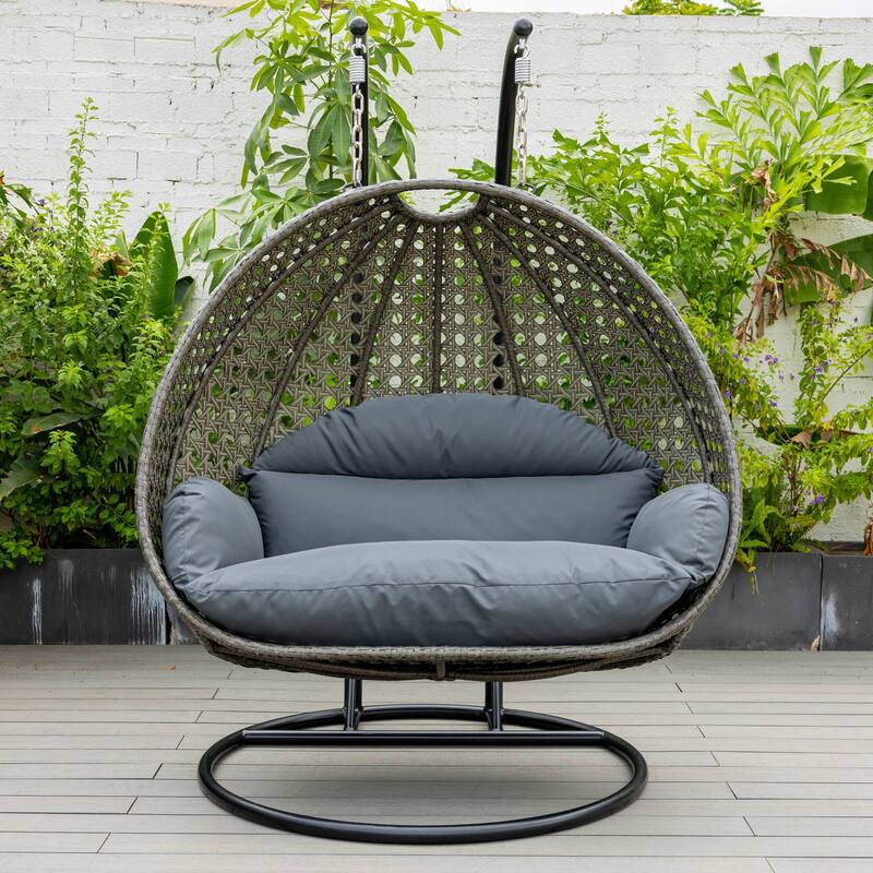 LeisureMod 2-Person Hanging Egg Swing Chair with Metal Stand - Handcrafted Charcoal Wicker, Patio Hammock Lounger with Cushions