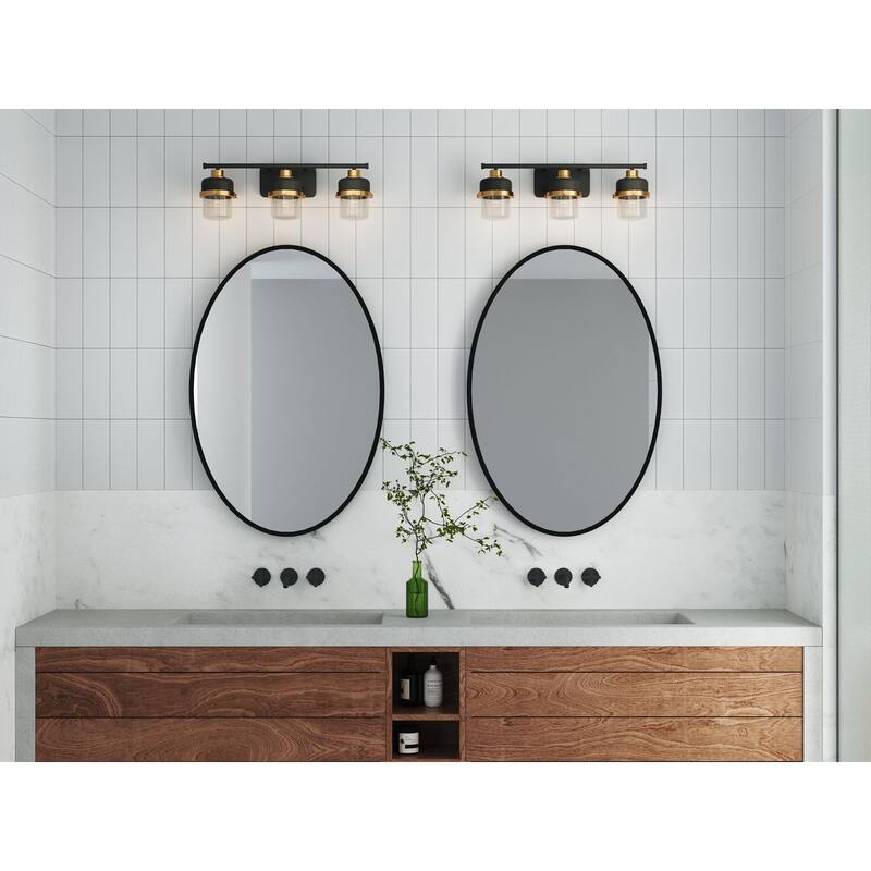 Beckner Collection Three-Light Matte Black Clear Glass Urban Industrial Bath Light with Vintage Brass Accents