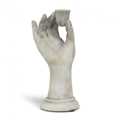 Raised Hand Holding A Taper Candle Holder