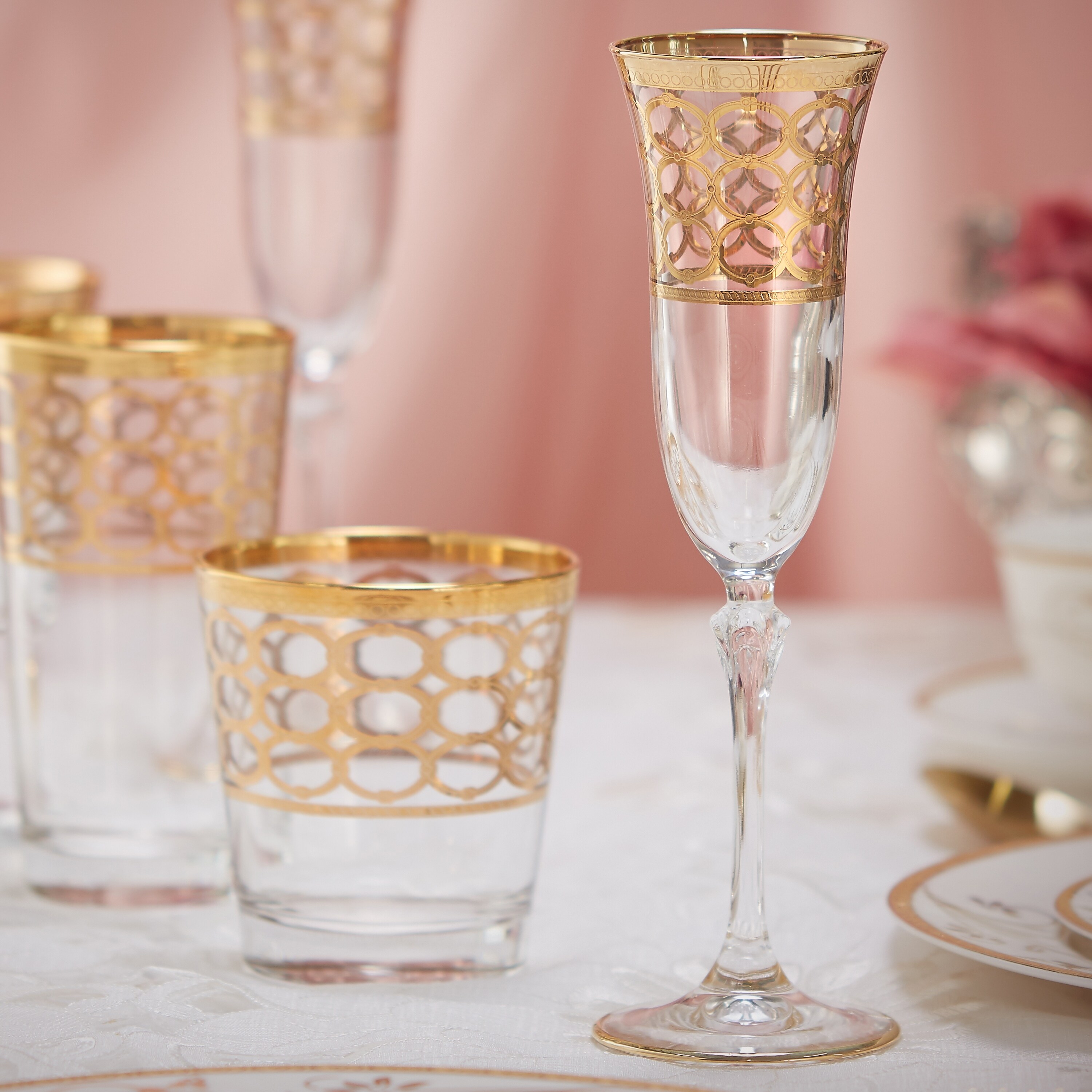 https://ak1.ostkcdn.com/images/products/is/images/direct/8fd52fc046151fc9731cea8764db88308c11a7ec/Lorren-Home-Trends-Infinity-Gold-Ring-Champagne-Flute%2C-Set-of-4.jpg