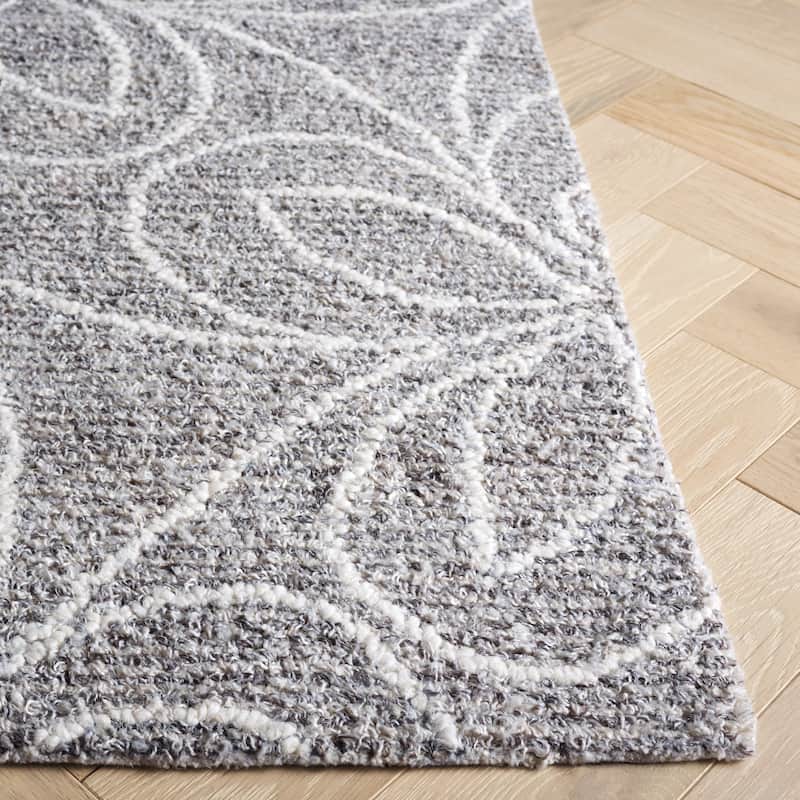 SAFAVIEH Handmade Ebony Edonjeta Wool Rug
