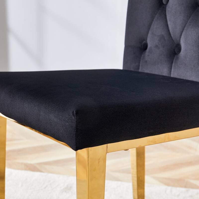 2 piece dining chairs.The gold metal legs complement the black velvet,showcasing a perfect blend