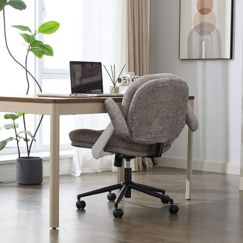 Grey Swivel Chair with Flip-Up Armrests and Crossed Legs