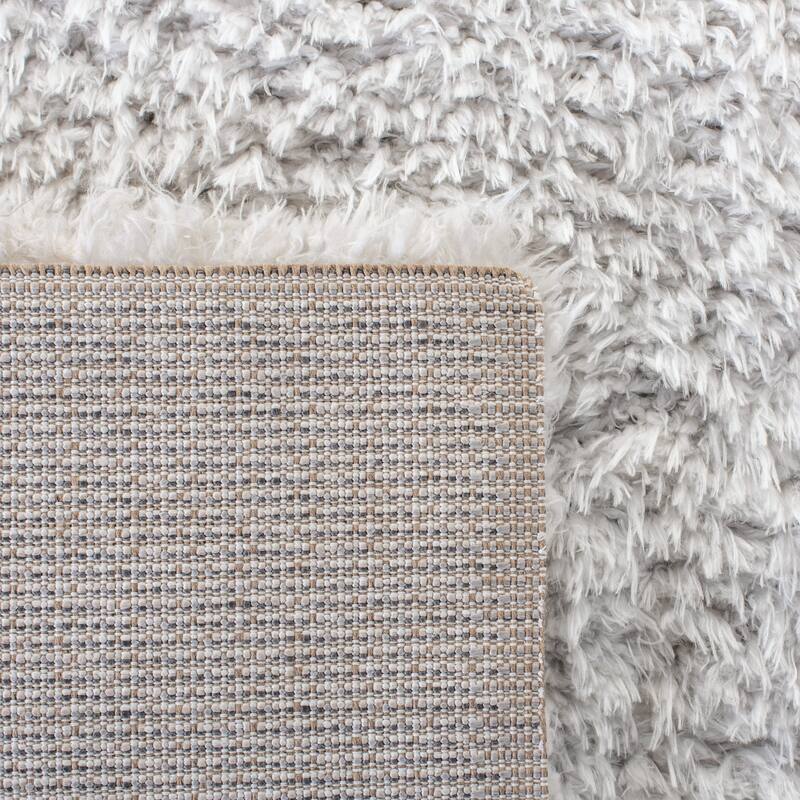 SAFAVIEH Flokati Vojsava Shag Solid Rug