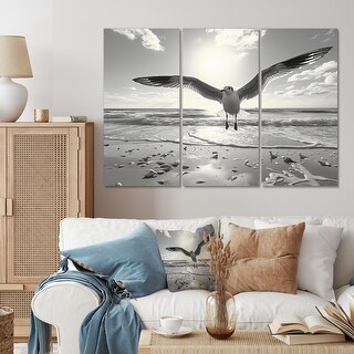 Designart "Grey Beach Seagulls In Flight IV" Animals Canvas Wall Art ...