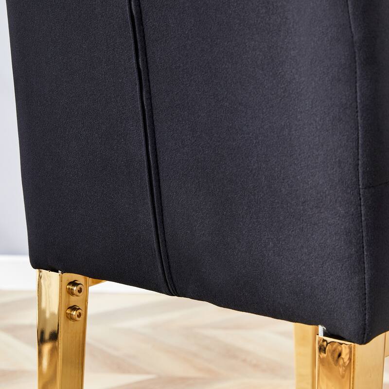 2 piece dining chairs.The gold metal legs complement the black velvet,showcasing a perfect blend