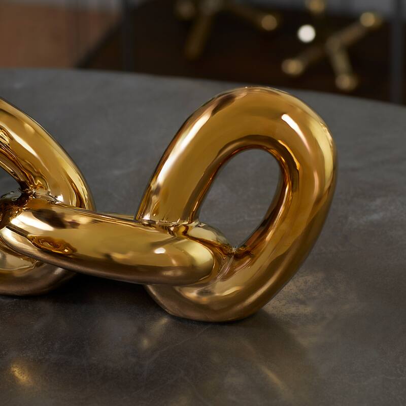 CosmoLiving by Cosmopolitan Gold Porcelain Ceramic Chain Decorative Sculpture (Set of 2)