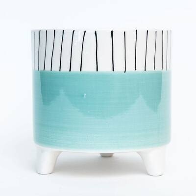 A Footed Aqua With Black And White Striped Rim Planter
