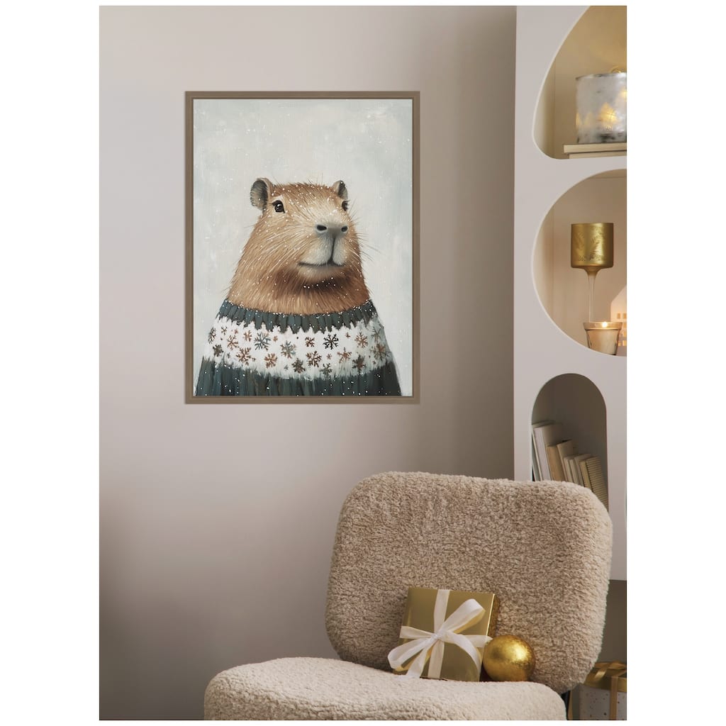 Kate and Laurel Sylvie Framed Canvas Capybara in Winter Snowflake Sweater by The Creative Bunch Studio