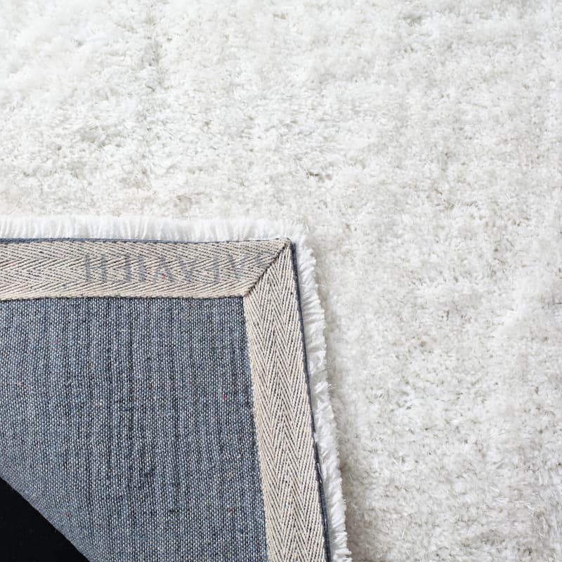 SAFAVIEH Handmade South Beach Leonella Shag Solid Polyester Rug