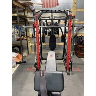 smith machine home gym with swing arm