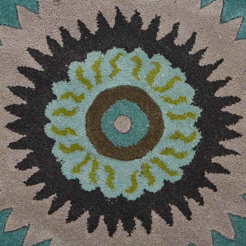 Sevita Bursting Peacock Wool Area Rug