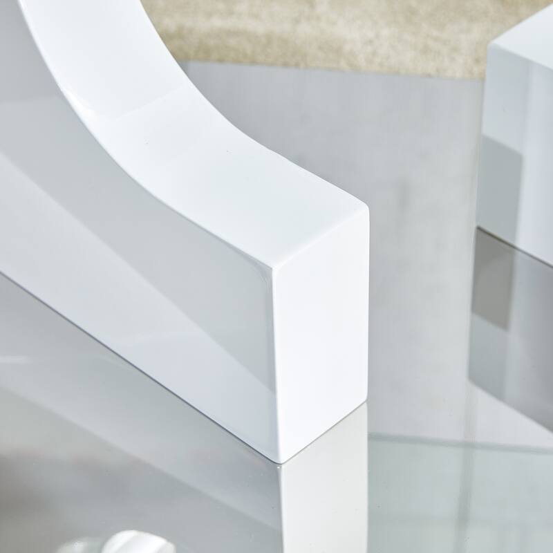 A rectangular modern and fashionable coffee table with tempered glass tabletop and white MDF legs. Suitable for living r